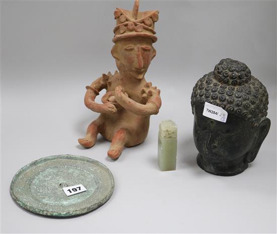 A bronze Buddha head, a Chinese bronze mirror and other items